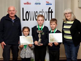 Allotment Holder with Children at School winning prize